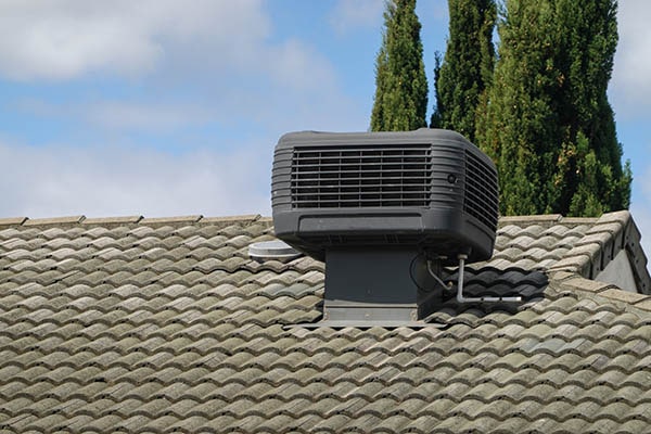 Evaporative cooling unit installation on roof
